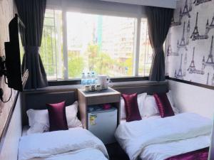 Postelja oz. postelje v sobi nastanitve Vve Vve Hotel
