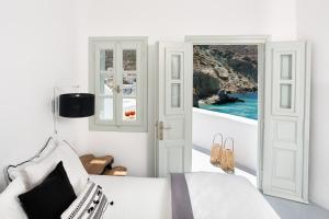 Uma TV ou centro de entretenimento em Blue Sand Boutique Hotel & Suites