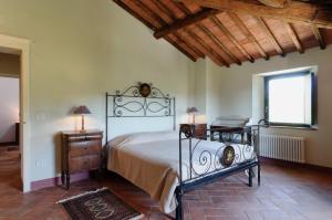 Postel nebo postele na pokoji v ubytování La Casaccia Guelfi + 62 fotografií