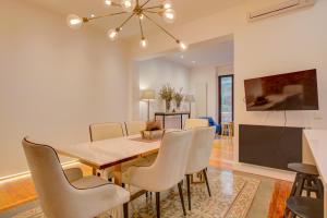 a dining room with a table and chairs at Luxury Flats Madrid Center in Madrid