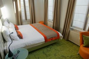 Hôtel du Parc Ath客房内的一张或多张床位