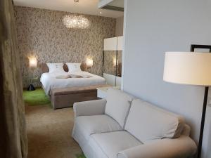 Hôtel du Parc Ath客房内的一张或多张床位