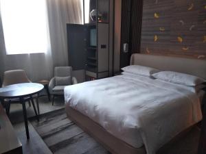 Postelja oz. postelje v sobi nastanitve Yunhe Yebo Hotel (Shanghai International Tourism Resort Pudong Airport)