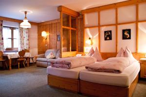 En eller flere senger på et rom på Hotel-Gasthof "Zur Mühle"