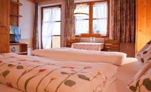 En eller flere senger på et rom på Hotel-Gasthof "Zur Mühle"