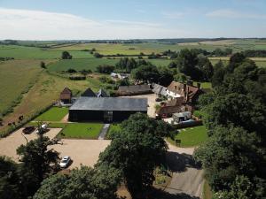 an aerial view of a house in a village at The Farmhouse at Redcoats in Stevenage