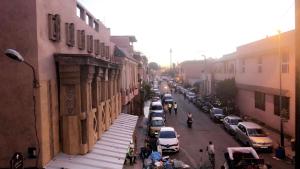 a view of a city street with cars parked at Dar Soraya al Madina Marrakech in Marrakesh