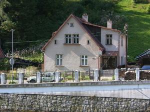 a house on the side of a hill with a fence at Holiday Villa Herlikovice in Vrchlabí