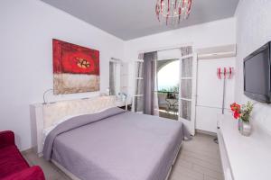 Postel nebo postele na pokoji v ubytování Aegialis Hotel & Spa