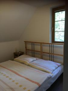 Postel nebo postele na pokoji v ubytování Chaty Marta