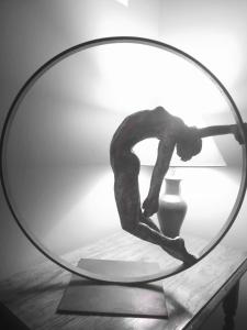 a sculpture of a man dancing in a mirror at La Haute Flourie - bed and breakfast -chambres d'hôtes in Saint Malo