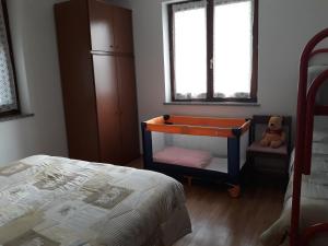 Posteľ alebo postele v izbe v ubytovaní Appartamento Lago