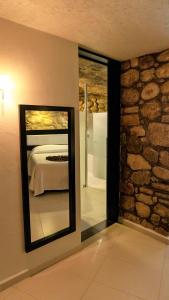 Postel nebo postele na pokoji v ubytování Hotel Nututun Palenque