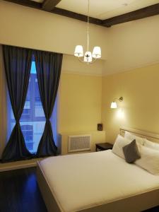 Cama o camas de una habitación en Residence Turgenev
