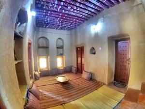 Letto o letti in una camera di Bait Aljabal Hospitality Inn