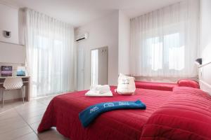 מיטה או מיטות בחדר ב-Hotel Foglieri
