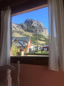a window with a view of a mountain at Complejo Las Maras in El Chalten
