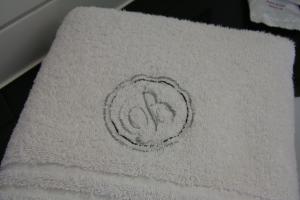 a drawing of a peace sign on a towel at Biznis Hotel in Lokeren