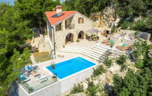 an aerial view of a house with a swimming pool at Villa Bogijeva in Rabac