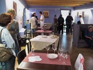 a group of people standing around a table with wine glasses at Solea Relais di Charme- Adults only in Trecastelli