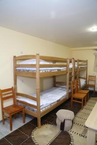 Ένα ή περισσότερα κρεβάτια σε δωμάτιο στο Arsego Hostel