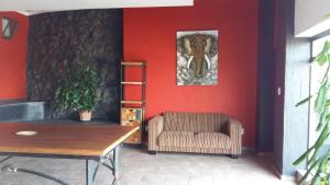 a room with a chair and a picture on the wall at Arek's Place in Krugersdorp