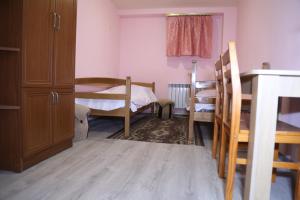 Ένα ή περισσότερα κρεβάτια σε δωμάτιο στο Arsego Hostel