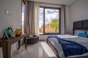 a bedroom with a bed and a large window at Marrakech Holiday in Marrakesh +34 photos