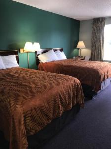 Postel nebo postele na pokoji v ubytování Americas Best Value Inn-Manchester