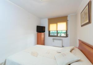 Posteľ alebo postele v izbe v ubytovaní Apartment Rambla Tarragona Free parking