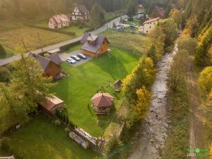 an aerial view of a house with a yard at Domek na Zagrodzie in Rycerka Górna