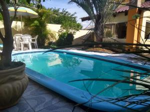 a swimming pool in the yard of a house at Apart São Gabriel in São Gabriel