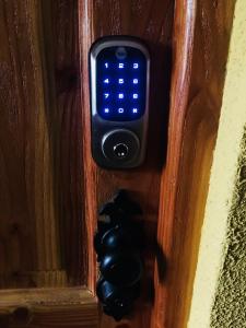 a remote control on a wall with blue lights at Departamento Pucón in Pucón