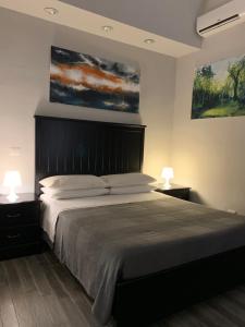 Postel nebo postele na pokoji v ubytování Caio Duilio B&B