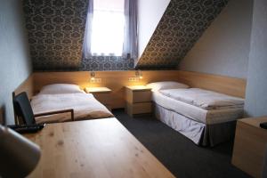 Postel nebo postele na pokoji v ubytování Pokoje gościnne Truskawkowa 1a