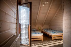 Кровать или кровати в номере Na Dworosku