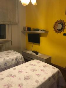 Postel nebo postele na pokoji v ubytování B&B Domus Benedicta