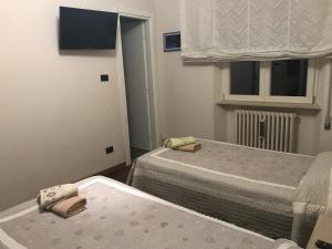 Postel nebo postele na pokoji v ubytování B&B Domus Benedicta