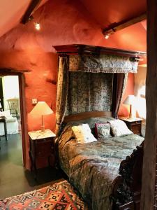 a bedroom with a large bed in a room at The Piggery - North Wales Retreat in Pwllheli