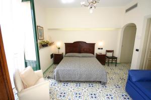 Postel nebo postele na pokoji v ubytování Sorrento Inn Guesthouse
