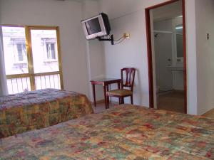 TV a/nebo společenská místnost v ubytování Hotel Posada Arcos