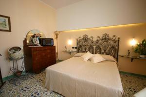 Postel nebo postele na pokoji v ubytování Sorrento Inn Guesthouse