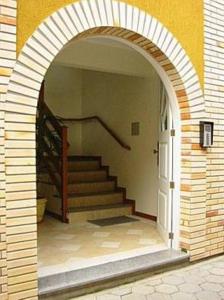 an archway in a building with a staircase in it at Residencial Solar Bela Vista in Florianópolis