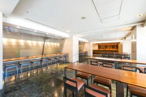 a dining room with tables and chairs in it at Hotel Villa Fontaine Tokyo-Ueno Okachimachi in Tokyo