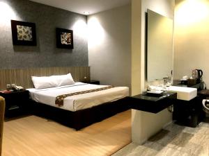 Letto o letti in una camera di Hotel Sinar 1