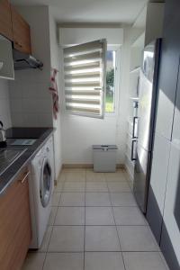 Kuchyň nebo kuchyňský kout v ubytování L'Océanide - Appartement avec balcon-terrasse et parking privé