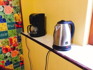 a coffee maker on a counter in a kitchen at Hostel Vokzal in Mukacheve