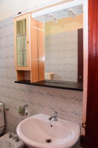 a bathroom with a sink and a mirror at Villa Roma - Negombo in Negombo