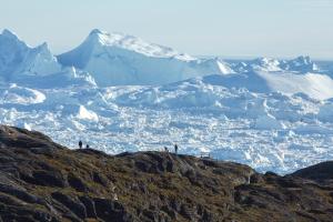 a group of people standing on top of a mountain at Hotel Icefiord in Ilulissat