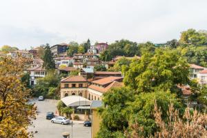a town on a hill with a parking lot at Domus Apartments Old Town in Plovdiv
